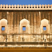 Amber Fort surrounded by high battlements built to protect the beautiful palaces and gardens inside. It is located on a hilltop in the north of Jaipur in Rajasthan.